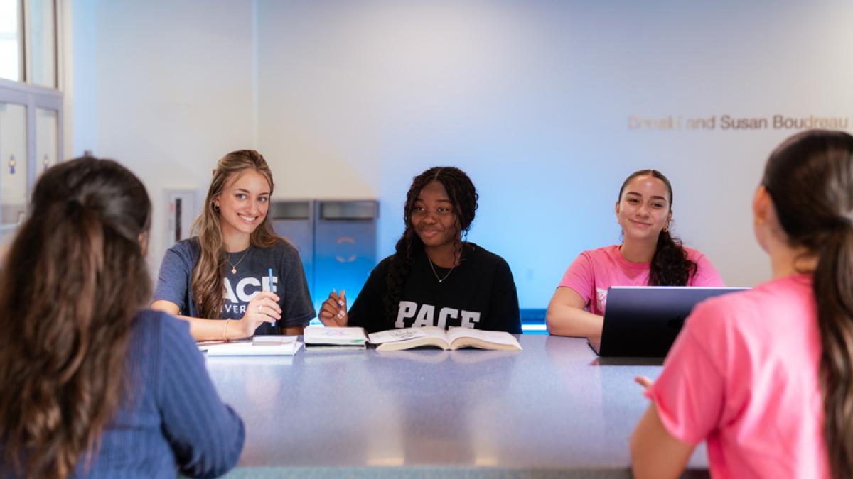 Group of Pace University students studying together.