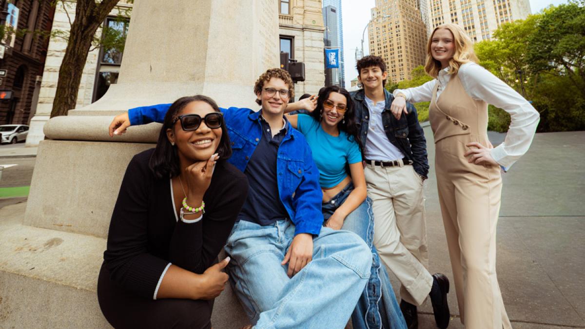 Group of Pace University students smiling at the camera in NYC.