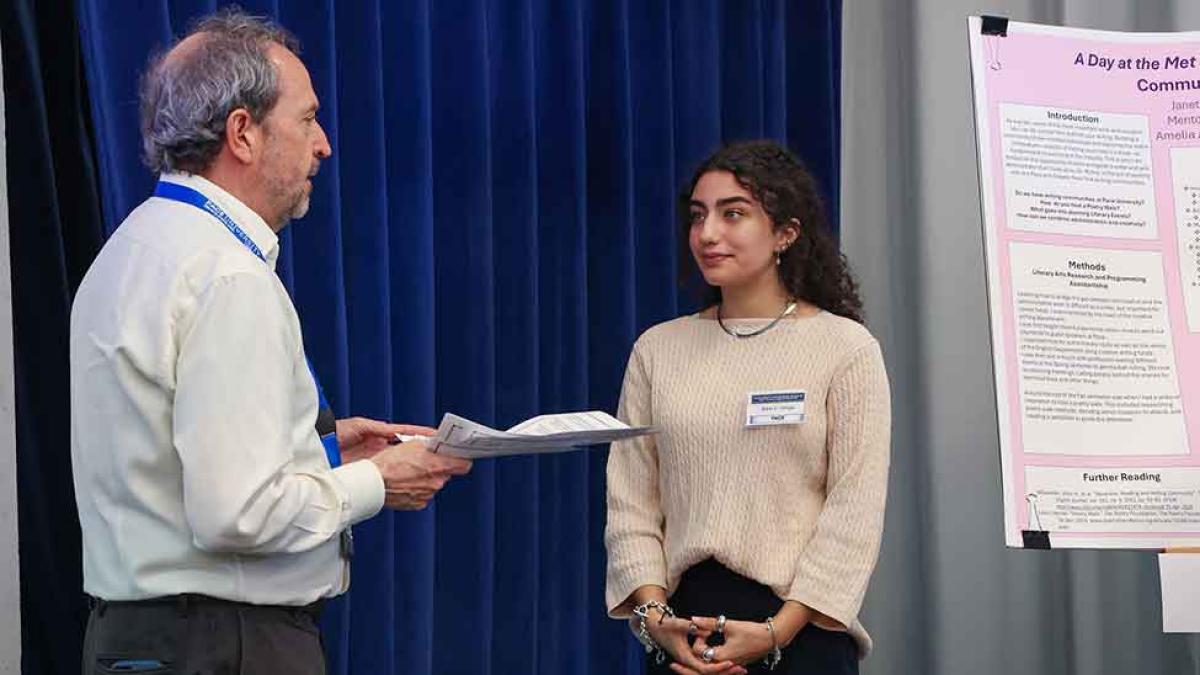 Pace University student presents her research to a faculty member