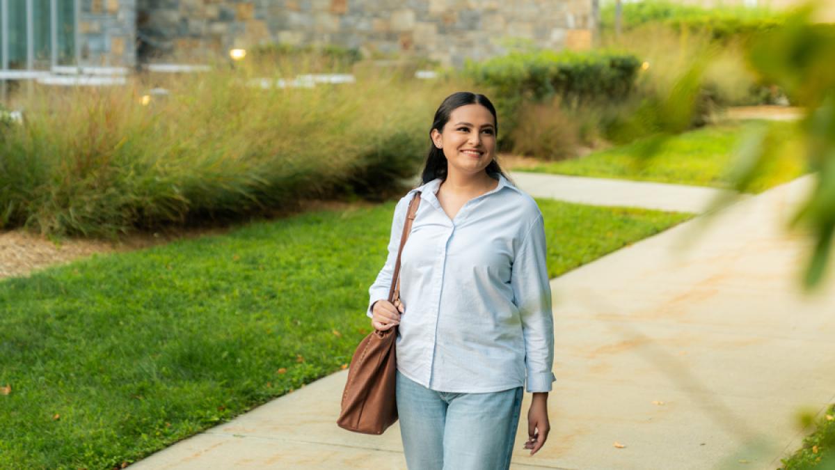 Pace University student walking around the Westchester campus.