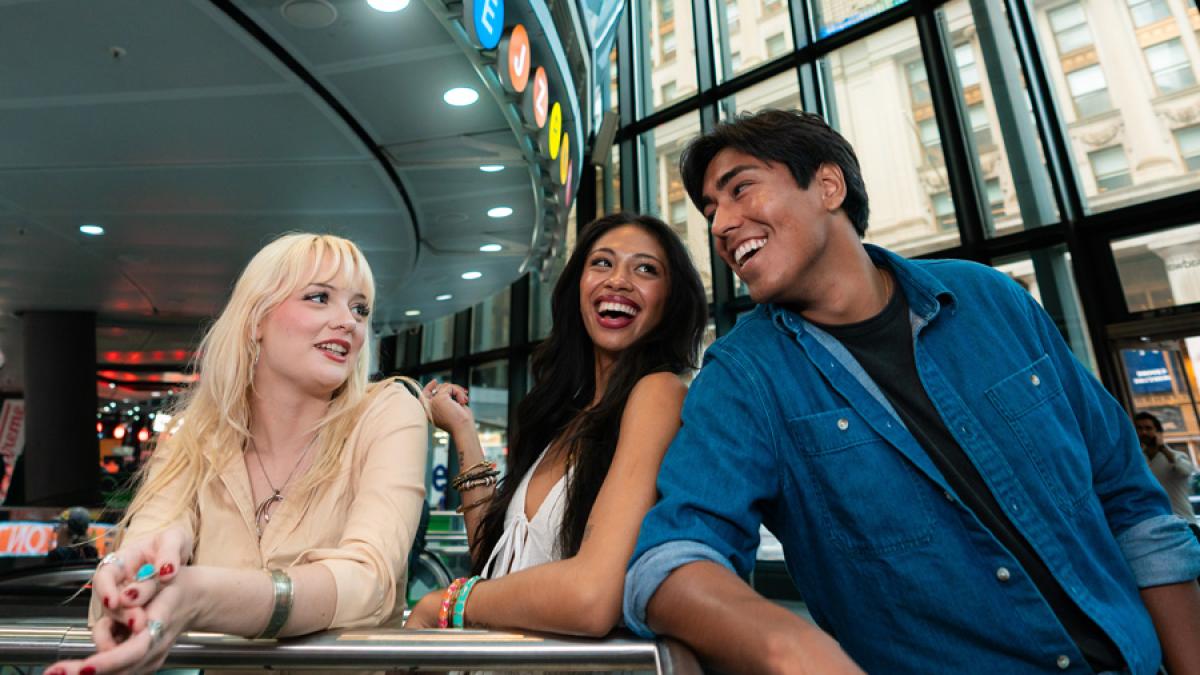 Three Pace University students in NYC taking the subway.