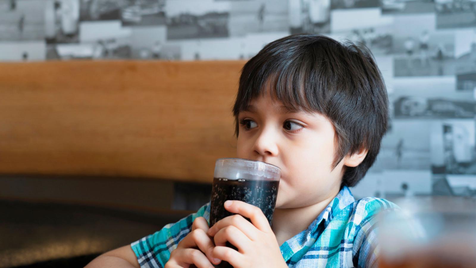 Child drinking a soda.
