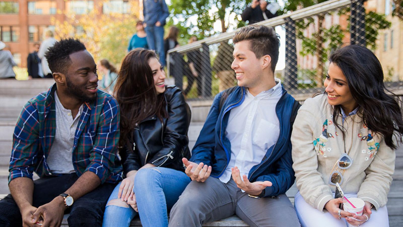 Group of Pace University students laughing.