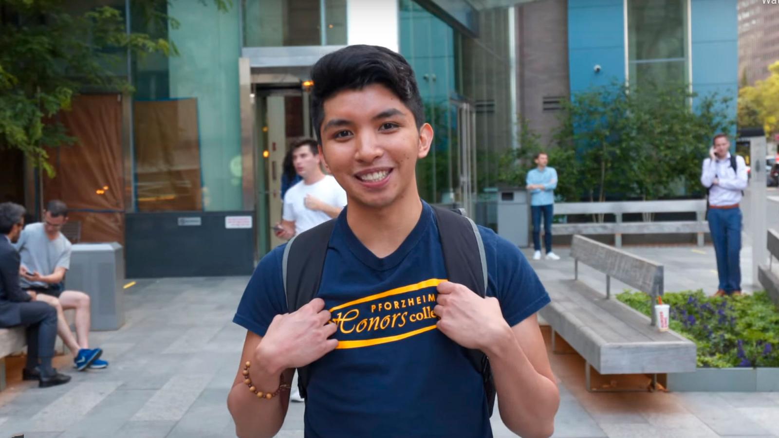 Pace student leaving one of the residential halls in NYC.