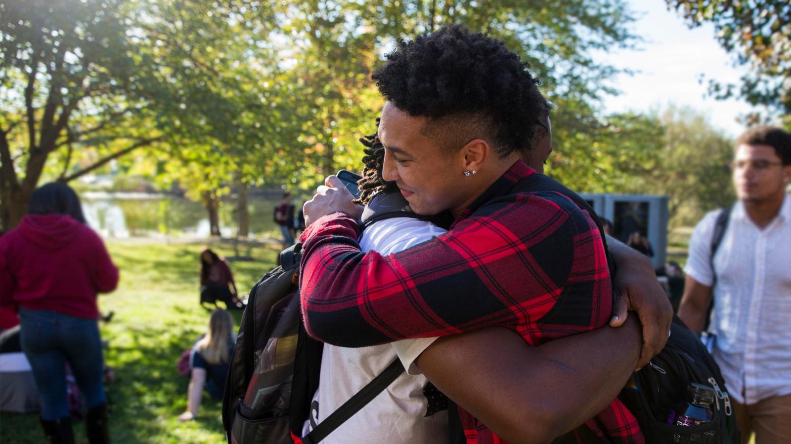 Students hugging.