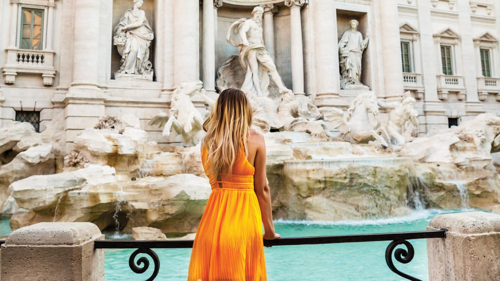 Student looking at a fountain in Italy.
