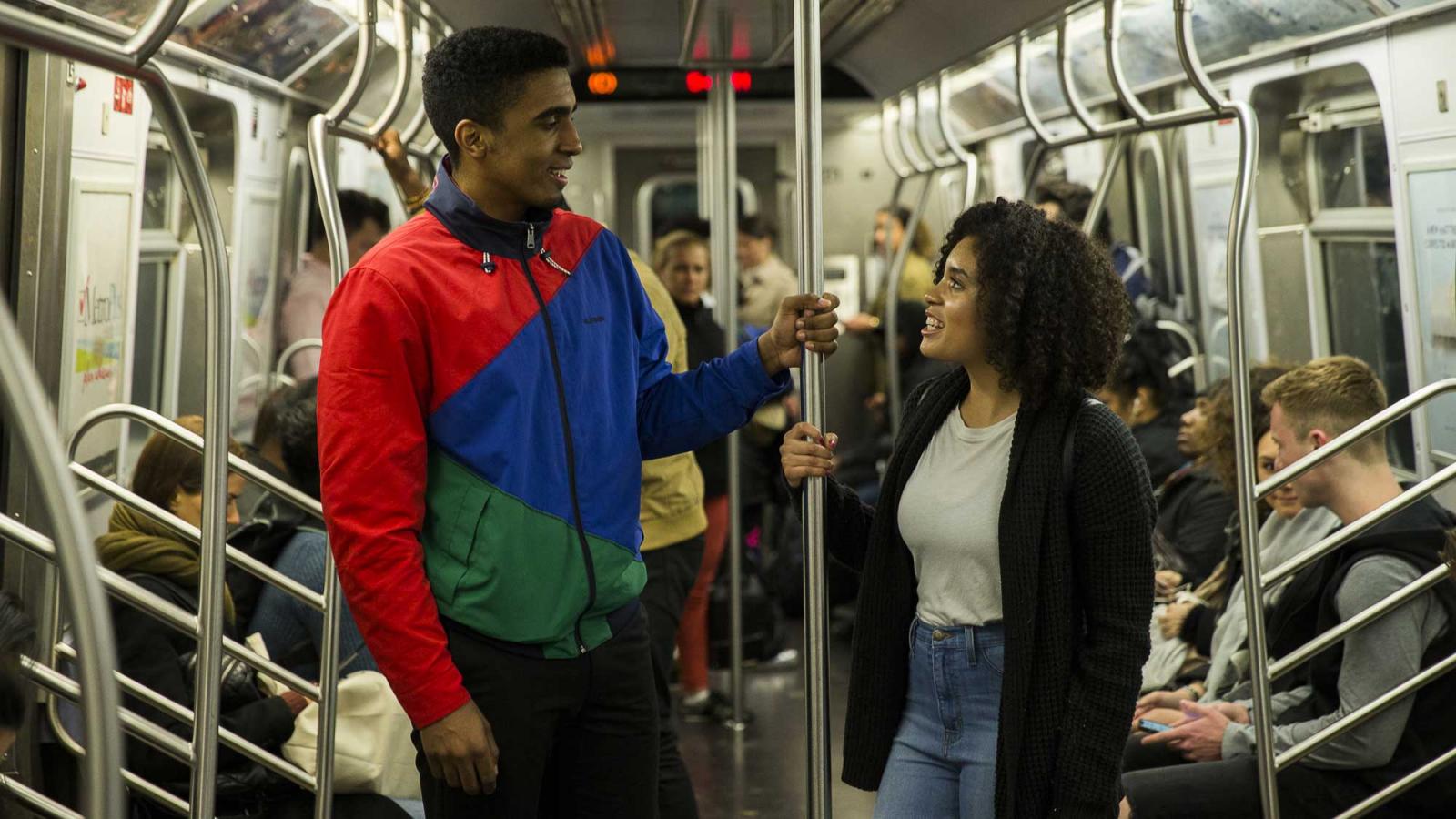 man and woman on a subway car