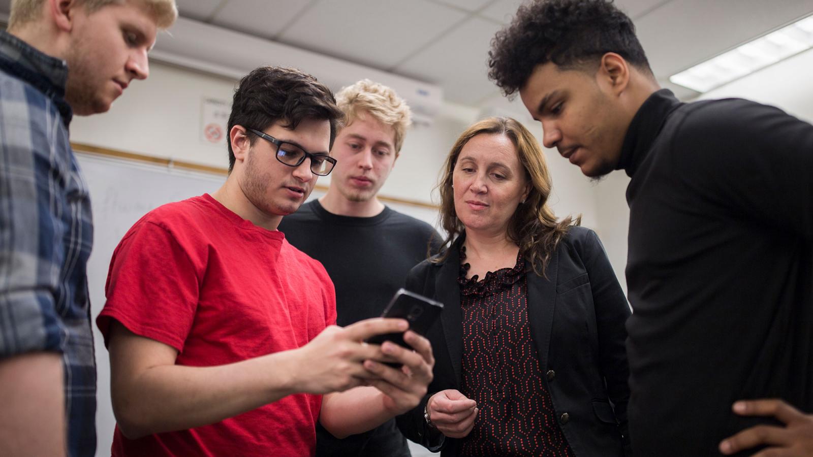 Professor Scharff working with students.