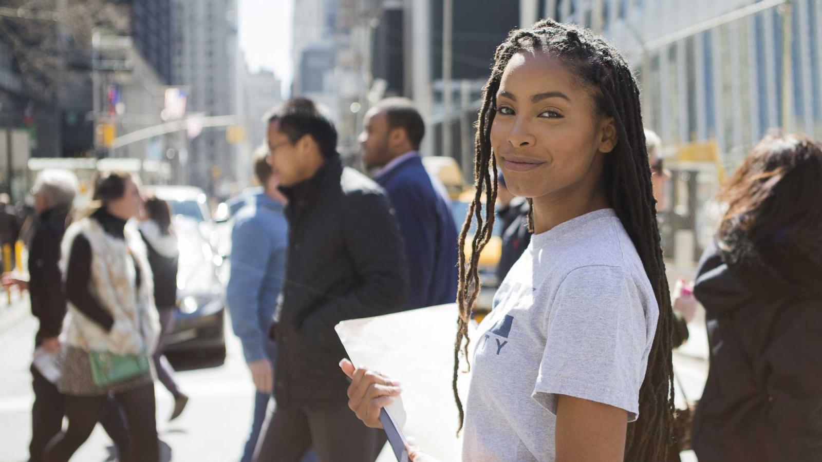 young woman crossing the street 