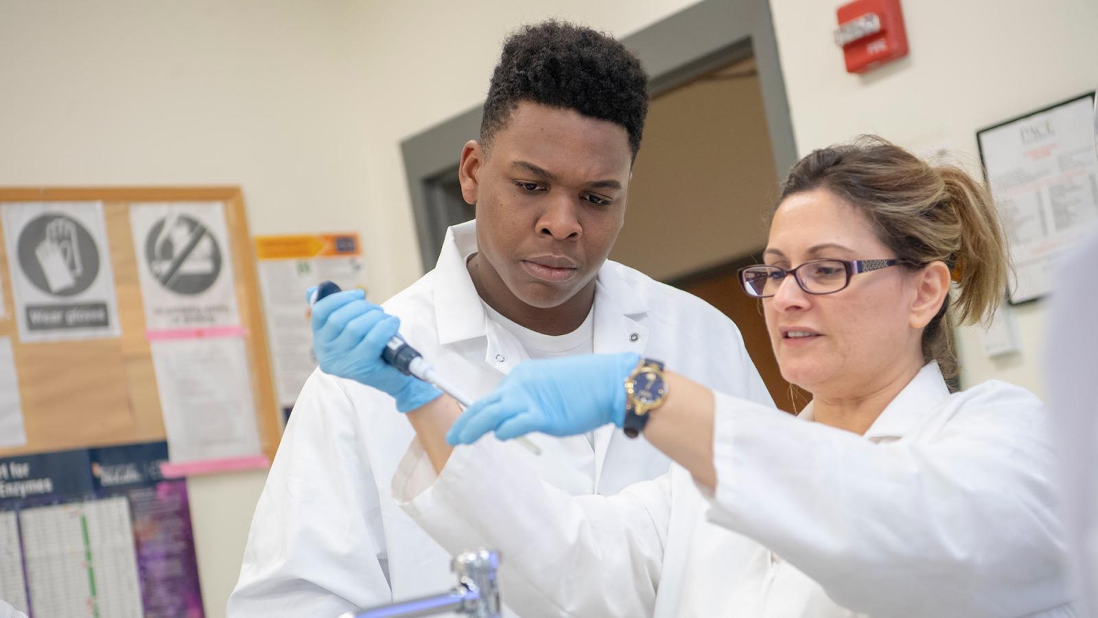 Student working with a faculty member on a project.