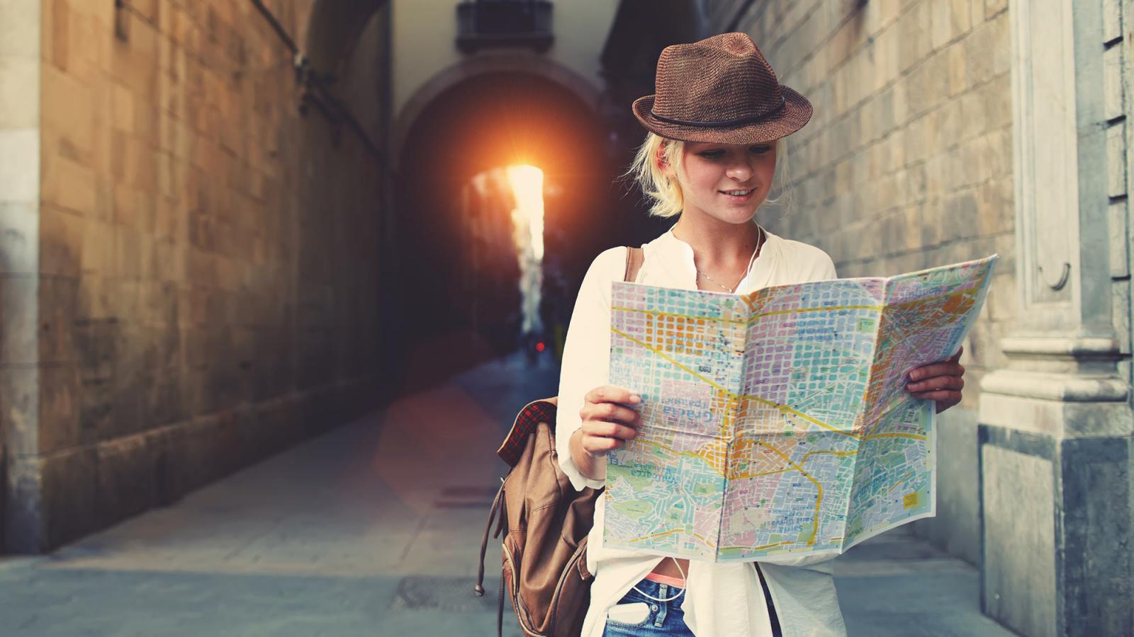 Student looking at a map while studying abroad.