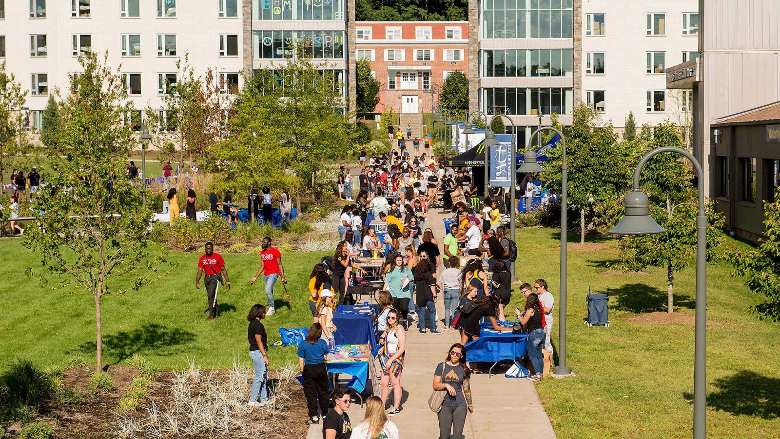 Students attending an activity fair at the Westchester campus.