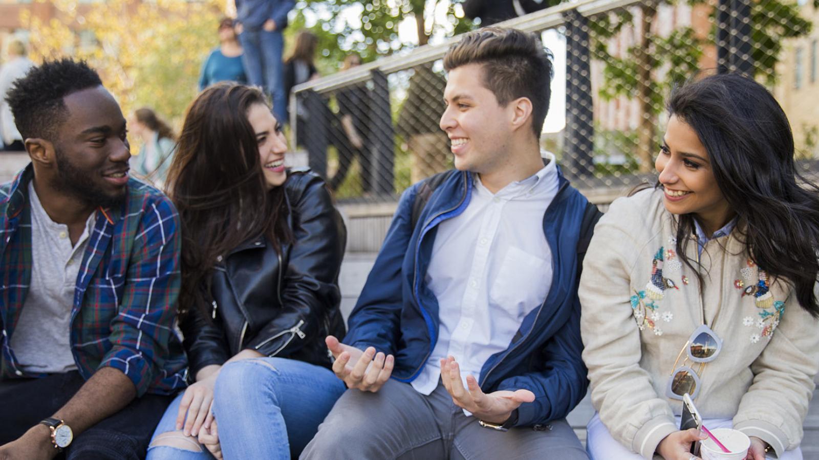 Group of Pace University students laughing.