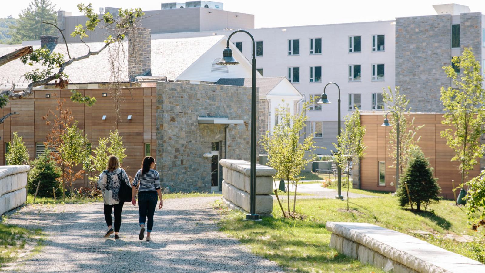 two students walking on the Pleasantville Campus of Pace University