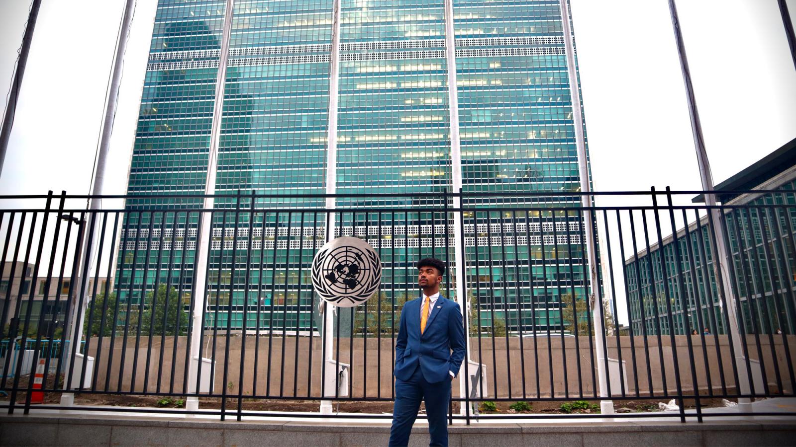 young man in front of the UN building