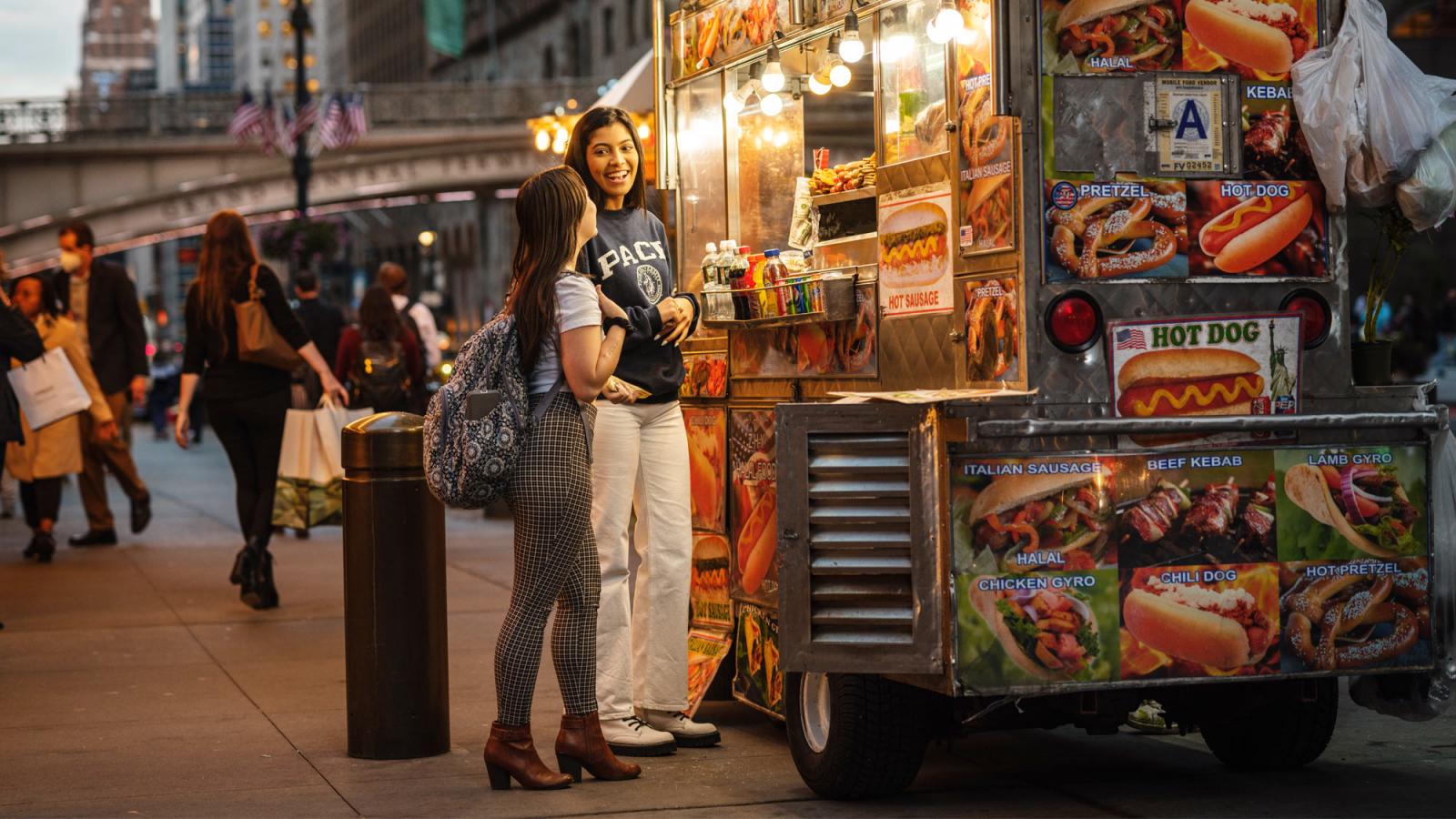 women at a food truck