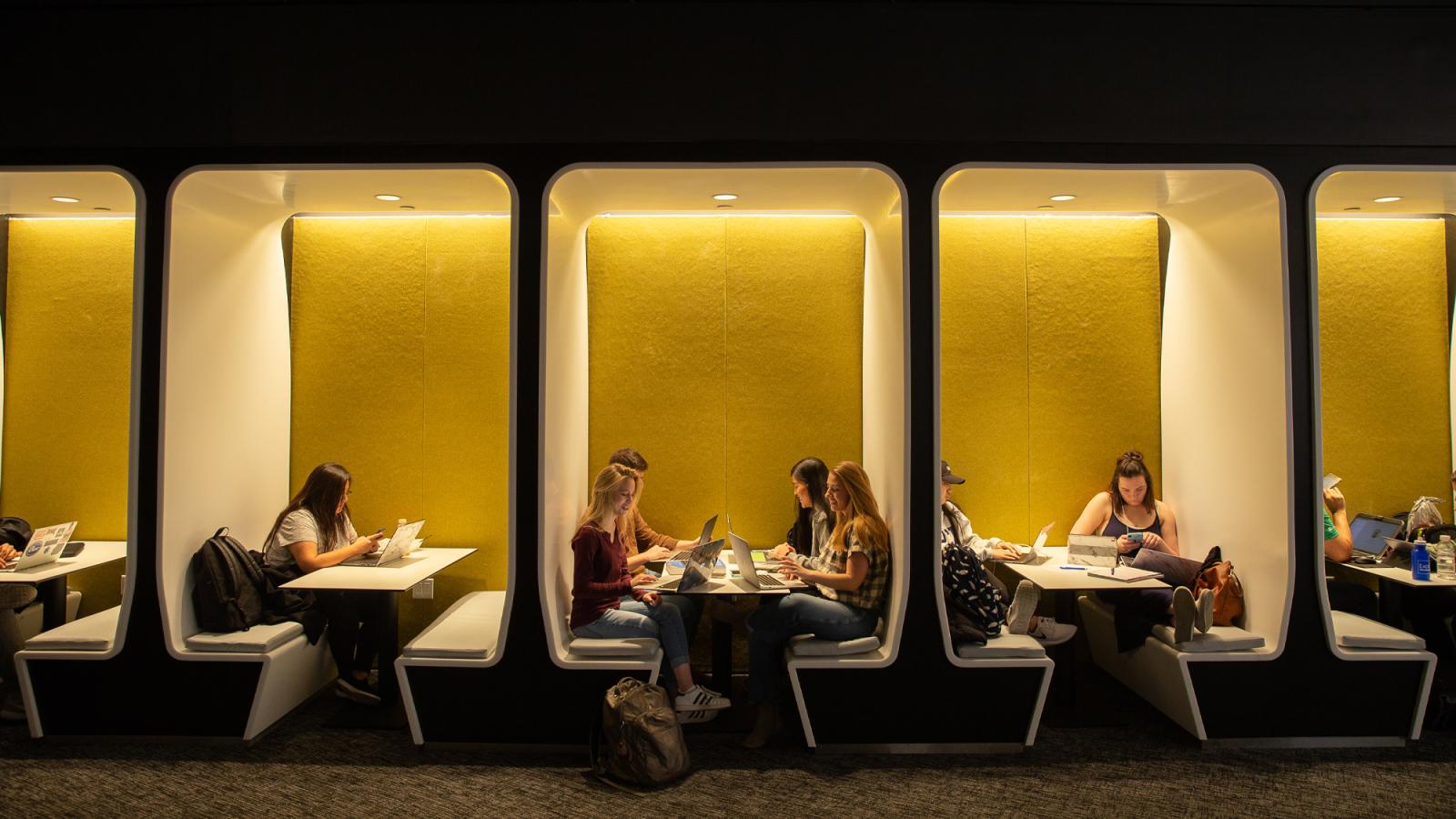 Student sitting at the study tables of One Pace Plaza