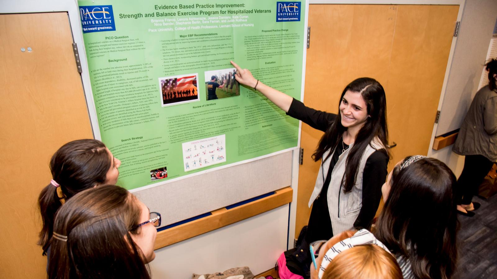 College of Health Profession's student presenting her research to other students.