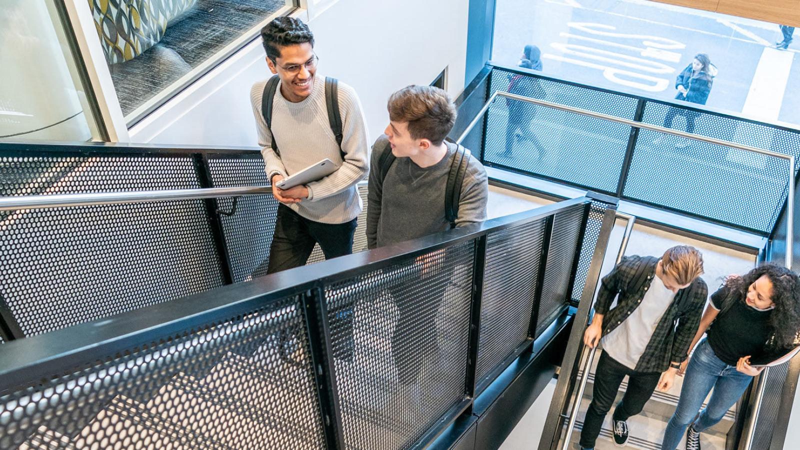 Students walking up the staircase at One Place Plaza, New York City Campus, Pace University