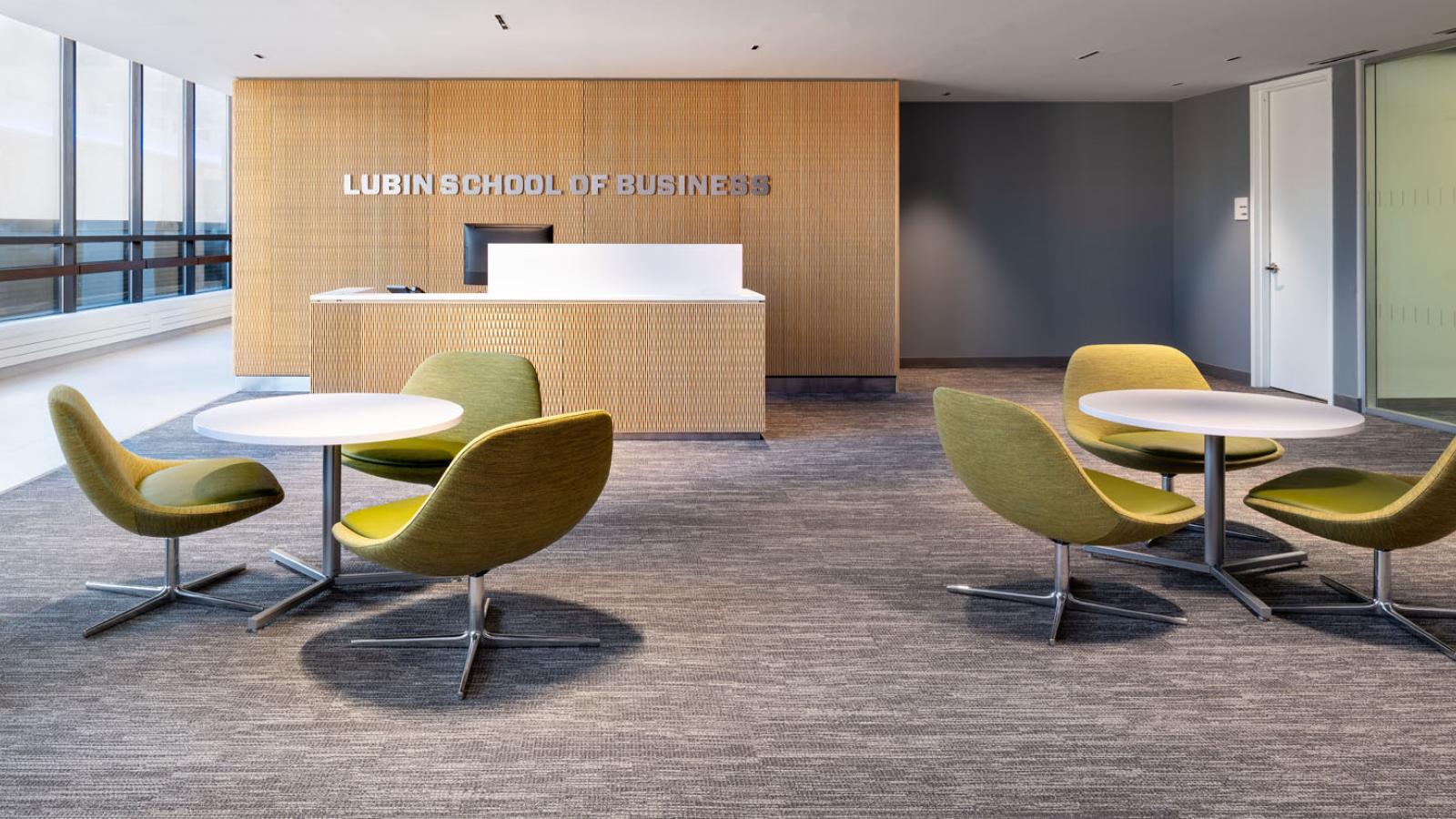 Lubin offices reception area with round tables and chairs representing Dean's Roundtable events