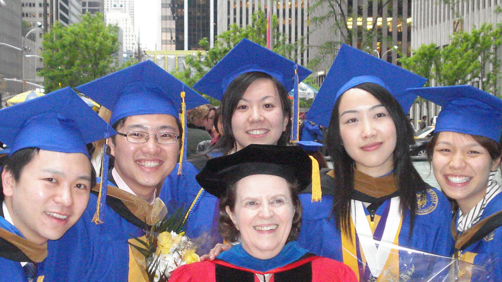 Lubin students and dean in front of One Pace Plaza after a New York City Annual Lubin Awards ceremony