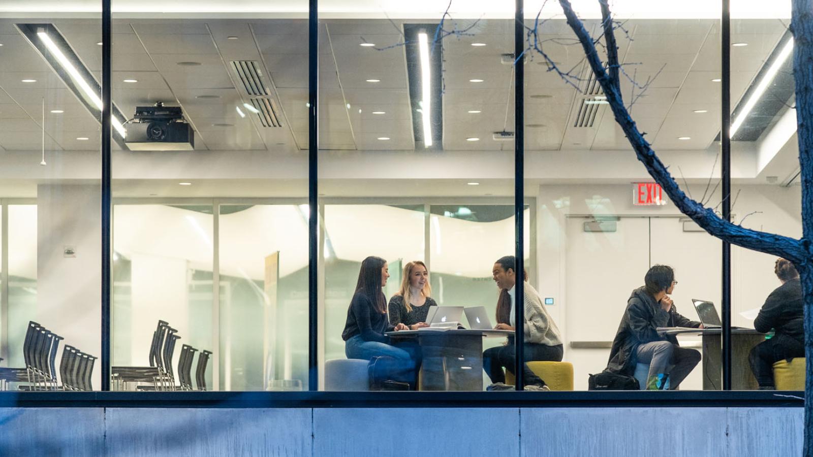 Pace students sitting in the Student Center of One Pace Plaza at the New York City Campus