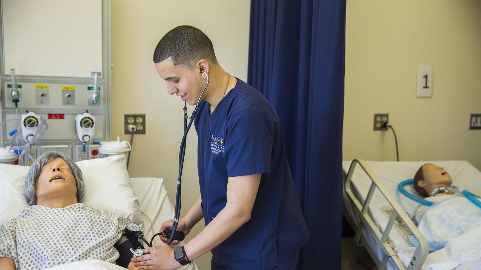 Nursing student in simulation lab.