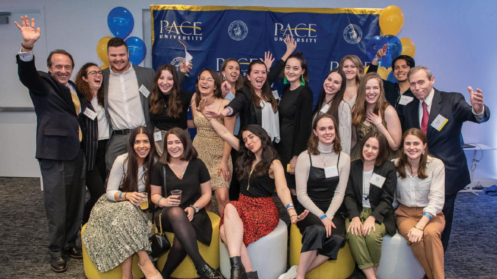 group photo with Emily Tree in the first row, third from the right