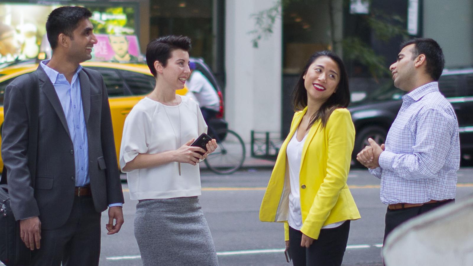 group of Lubin graduate students walking in Lower Manhattan near Pace University's New York City Campus