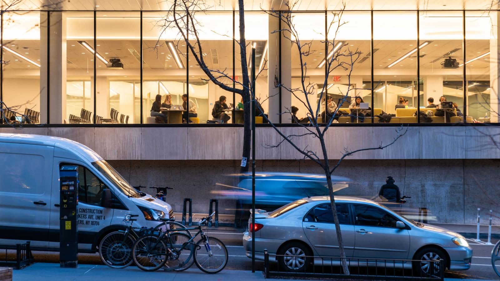 nyc street with view into a building through windows