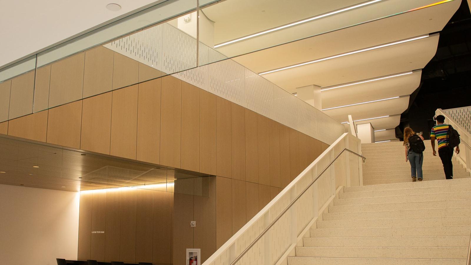 Students walking up stairs in One Pace Plaza