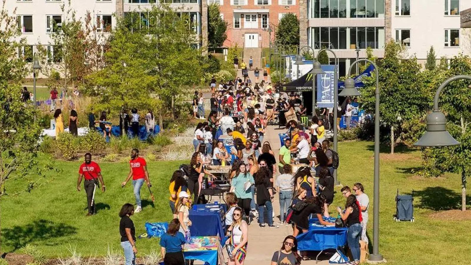 student activities fair on the lawn of the Pleasantville Campus