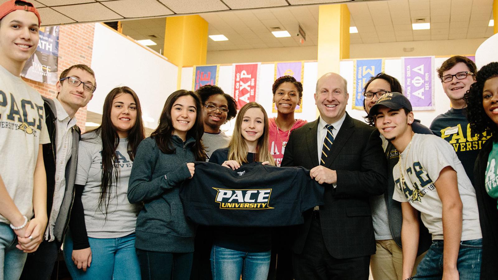 Pace University President, Marvin Krislov with students in the Kessel Student center