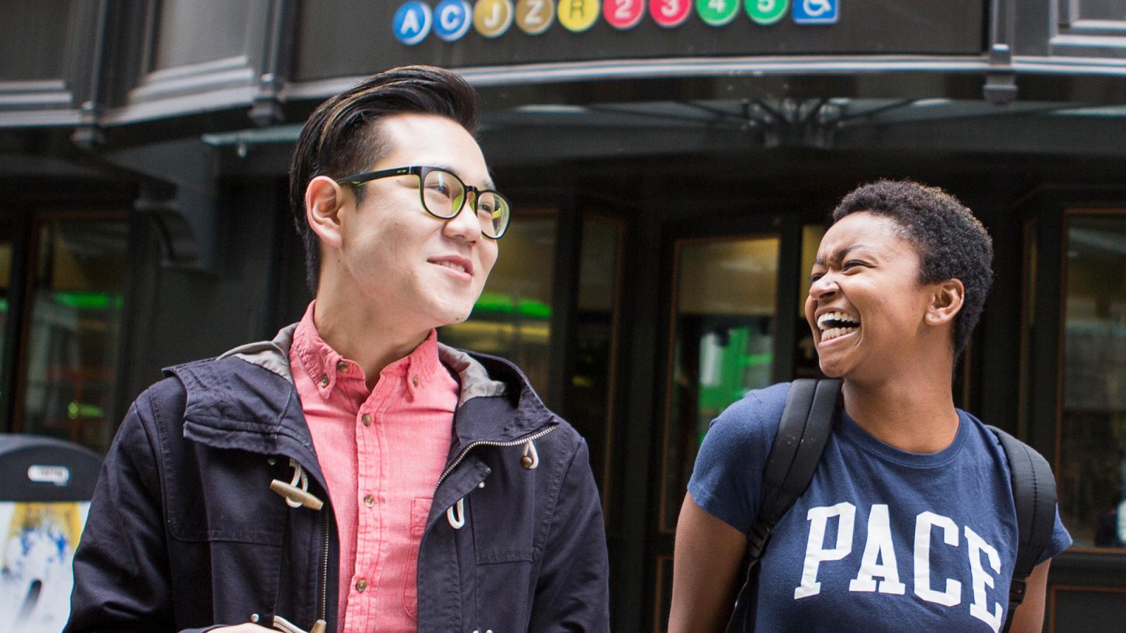 Two students walking aorund the NYC campus.