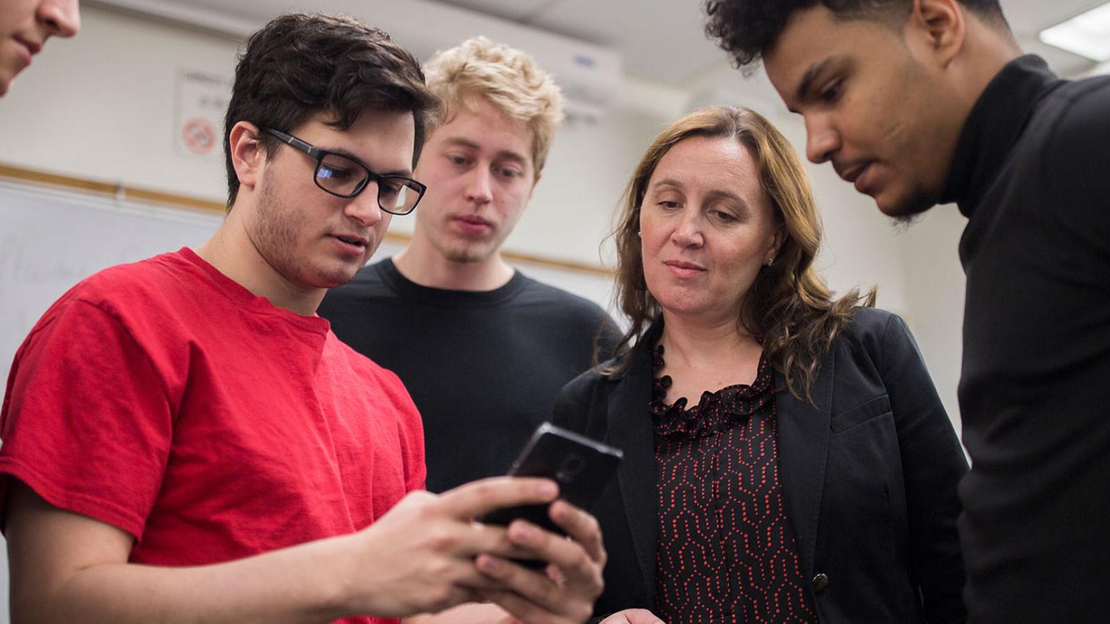 Professor Scharff working with students.