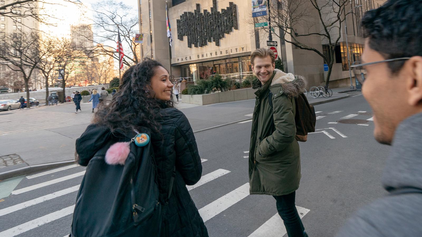 Students walking into 1 Pace Plaza in NYC.