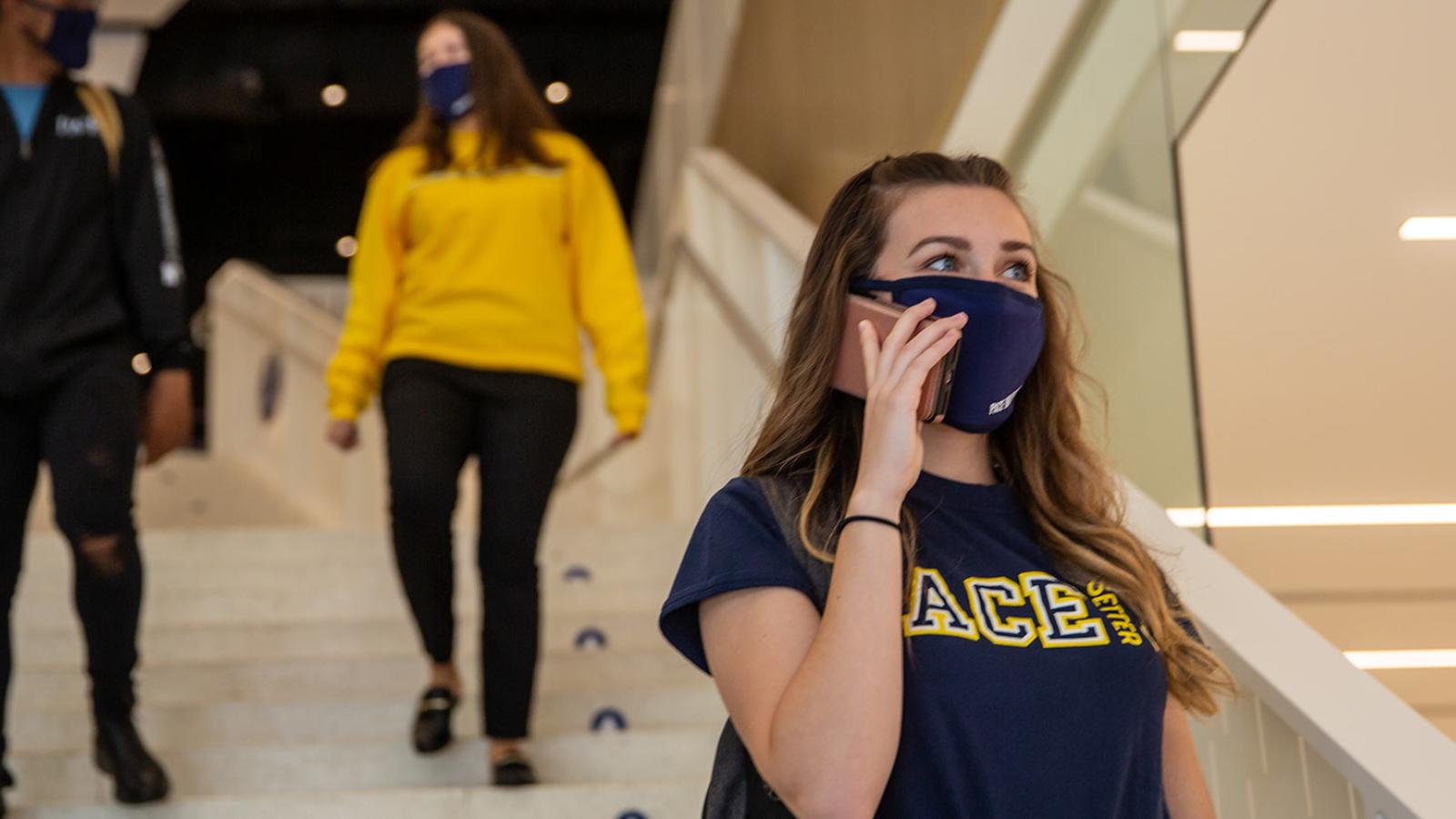 Female Pace University student on her cellphone