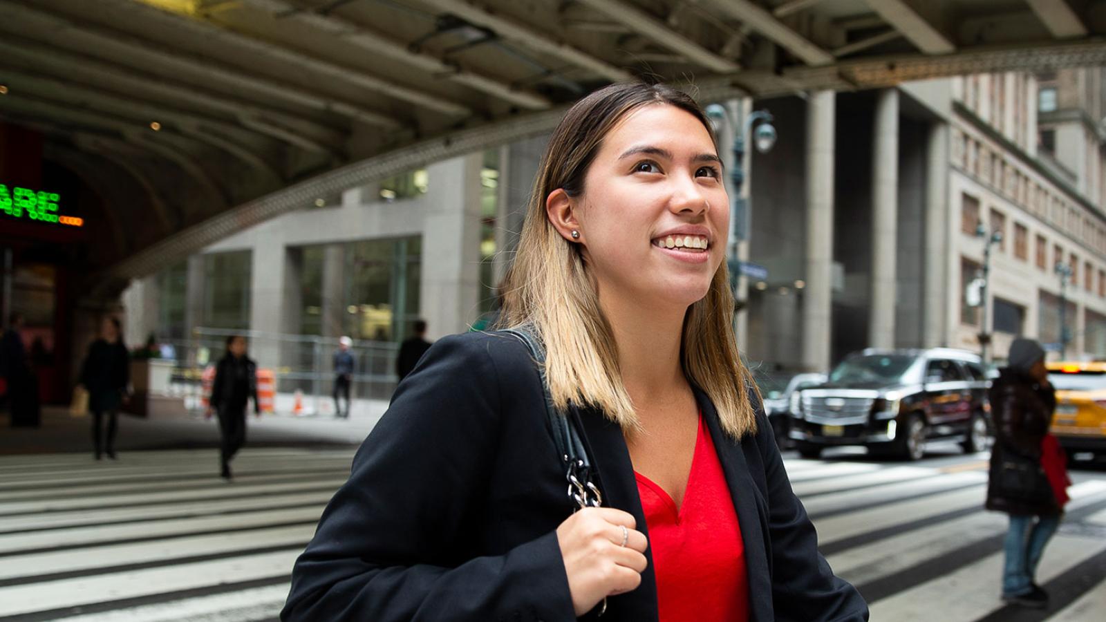 Student crossing a street in NYC.