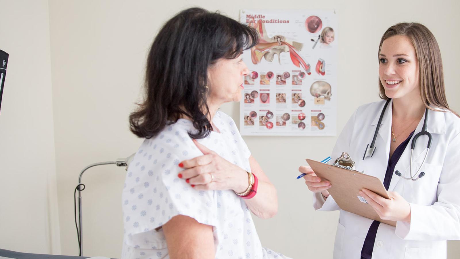 Pace nursing student speaking with a patient