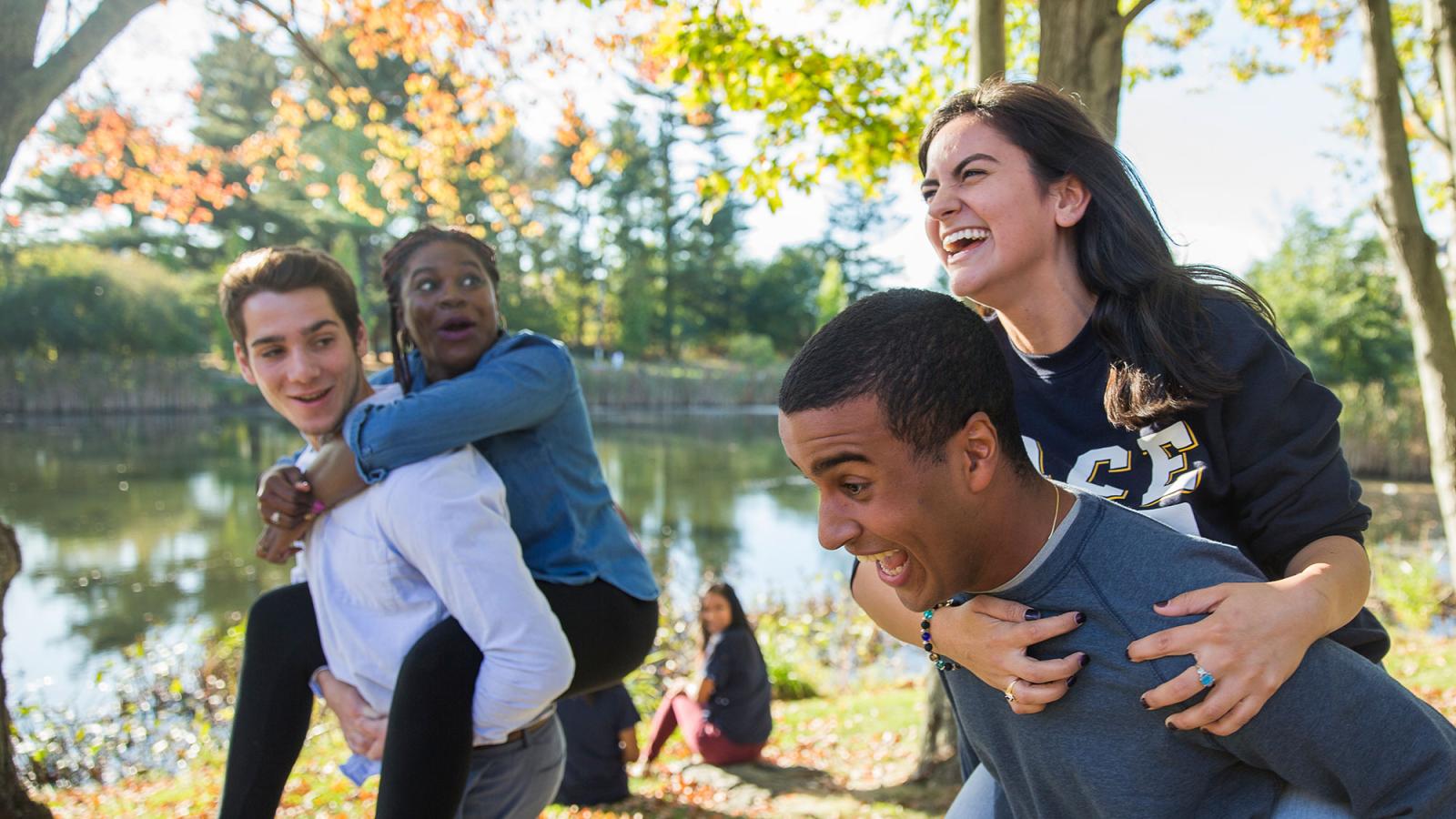 Students giving each other piggy back rides.