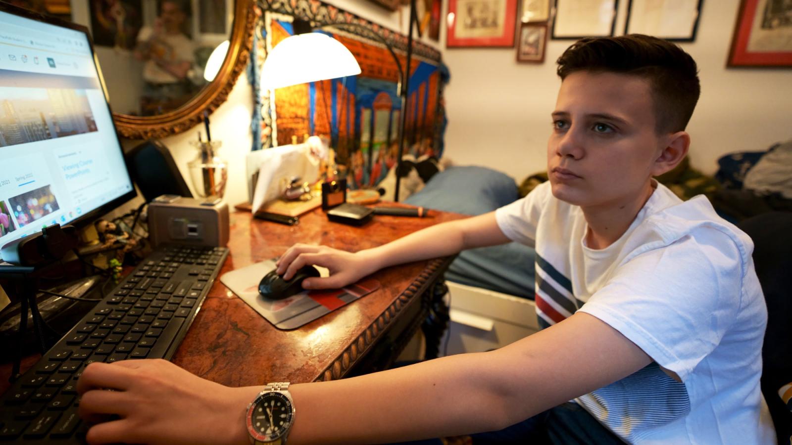 young boy at desk