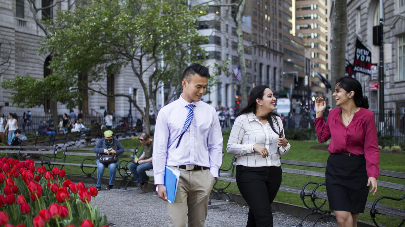 three students walking in lower Manhattan