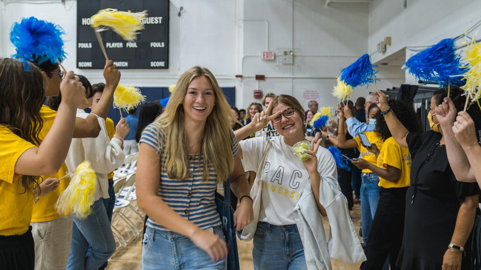 group of people with pompoms