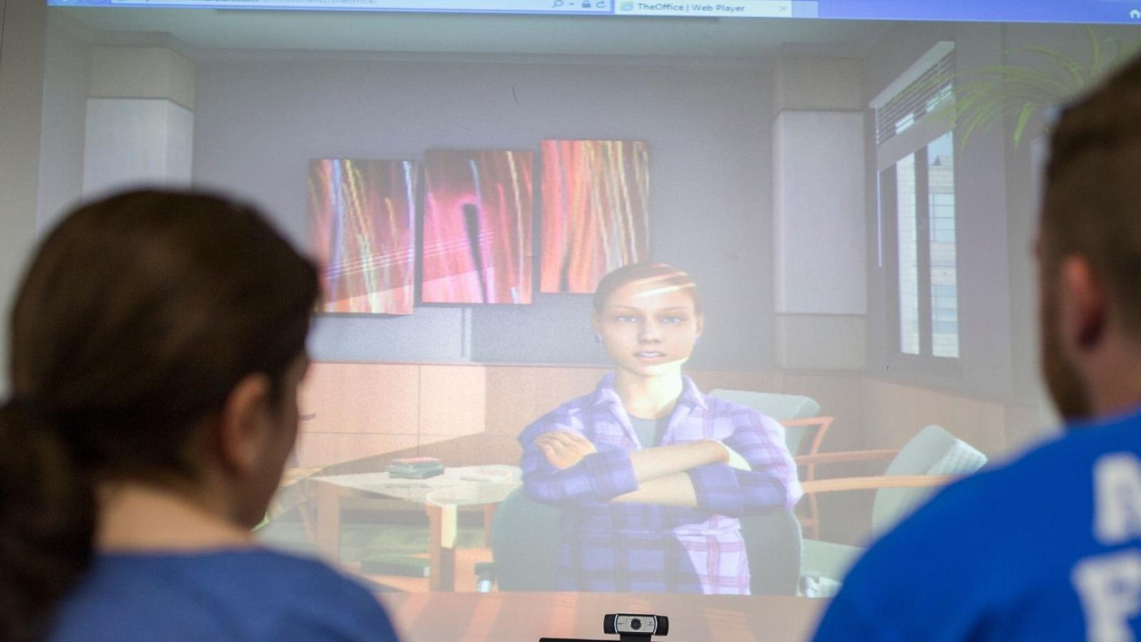 Students interacting with classroom simulation technology