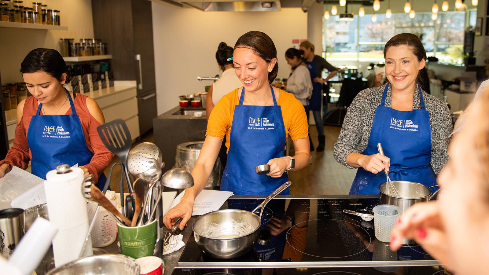 Students working in the kitchen.