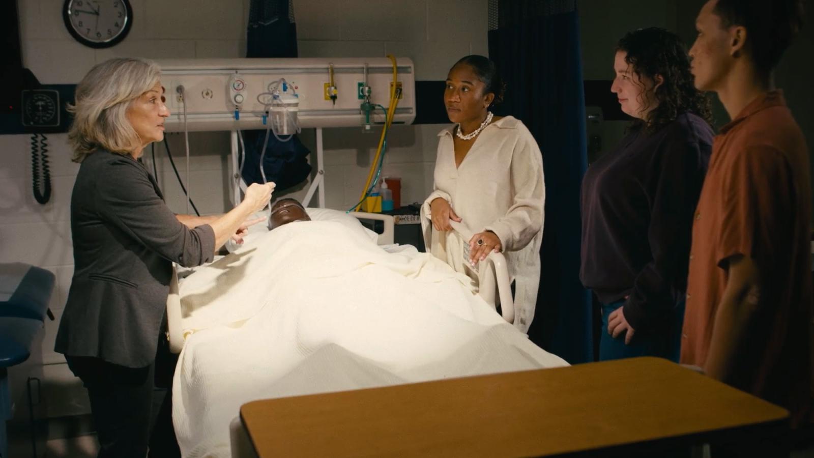 people standing in a hospital setting