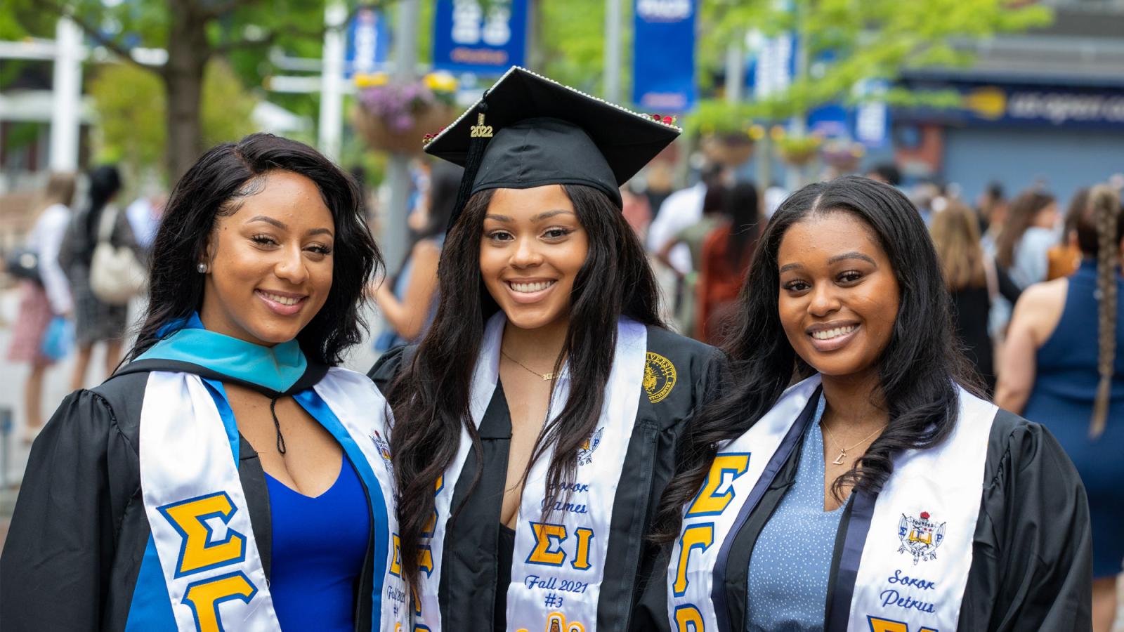 graduates smiling