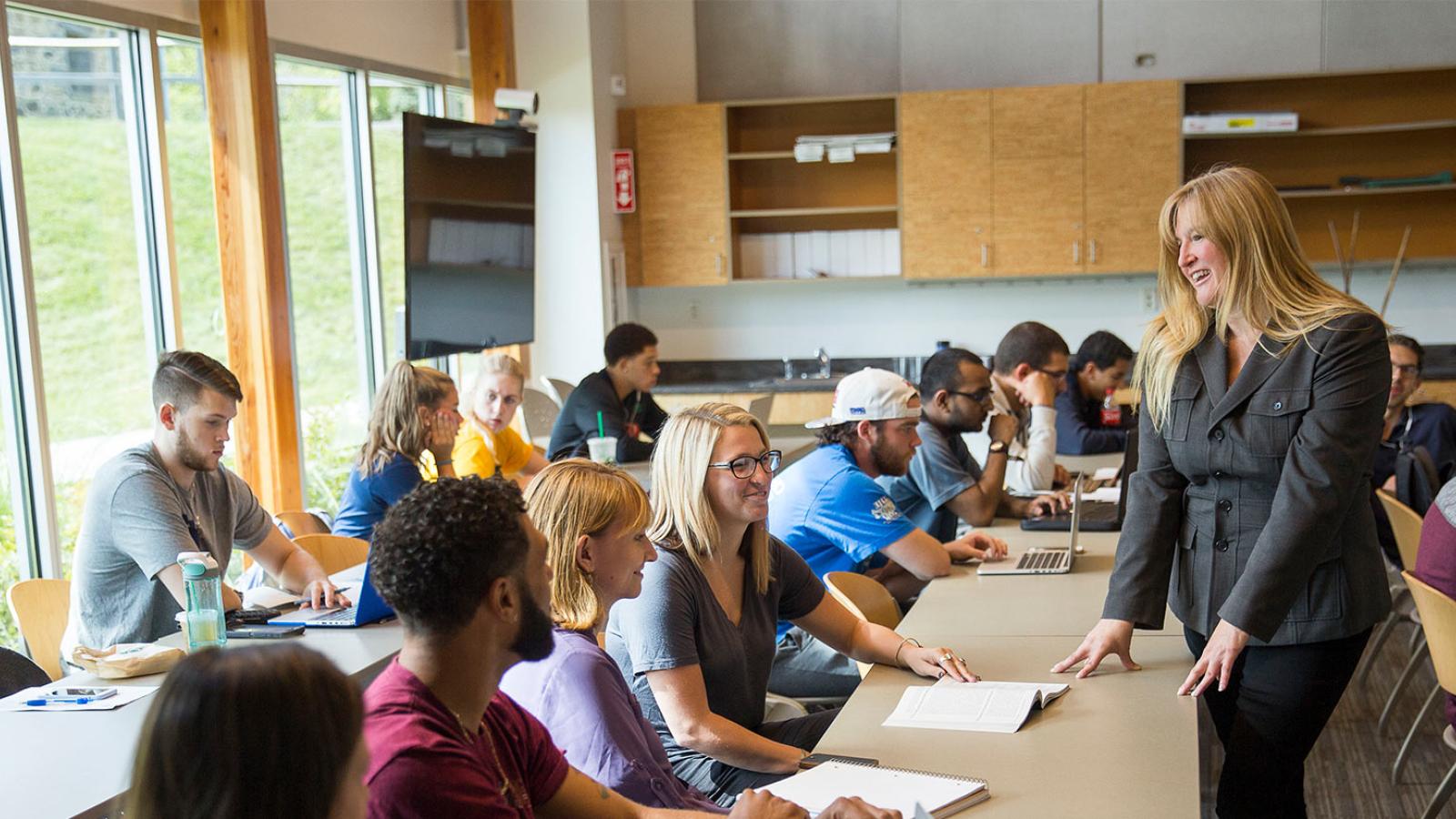 students in classroom with professor