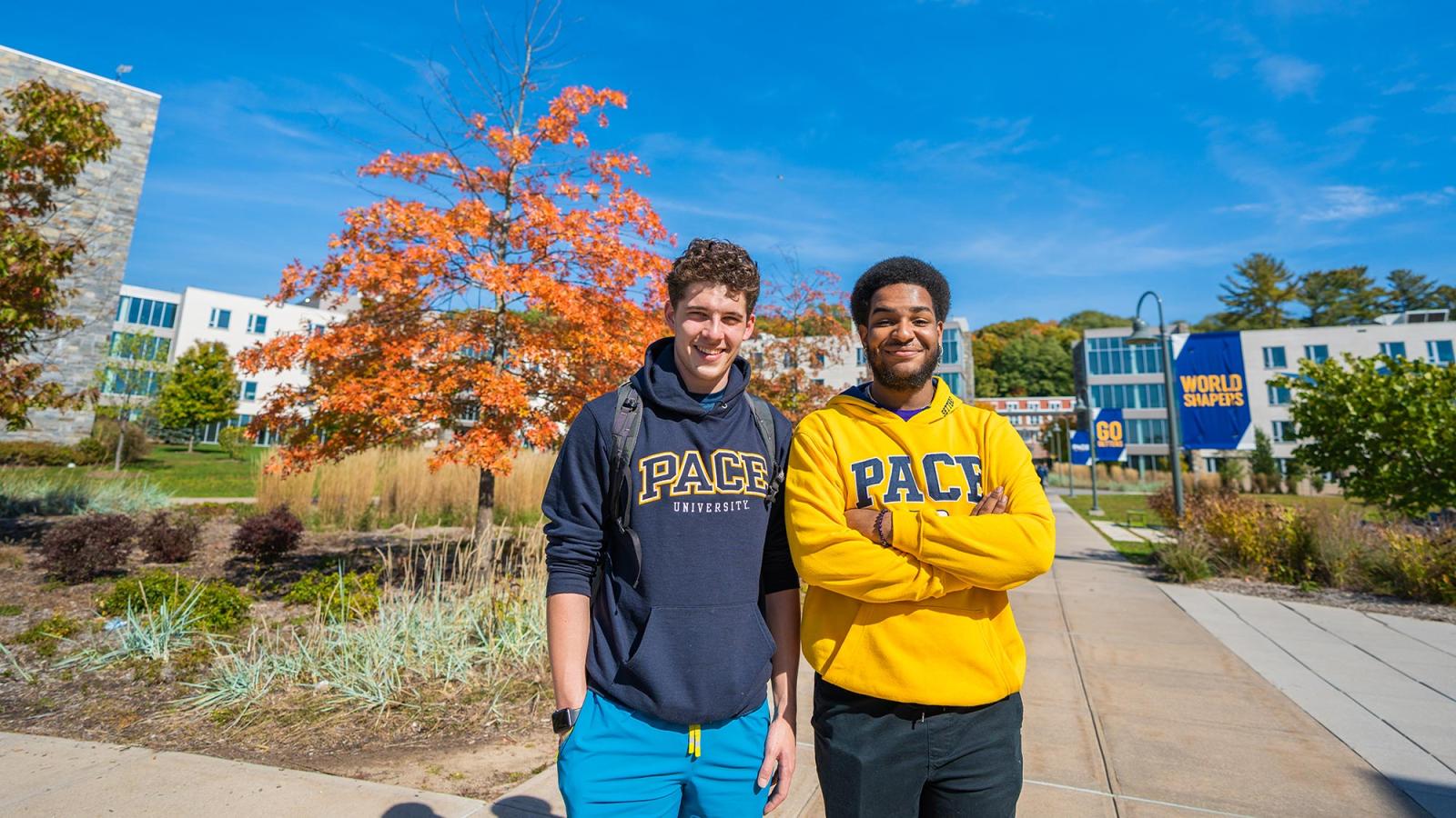 Two students enjoying a nice day on the Westchester Campus