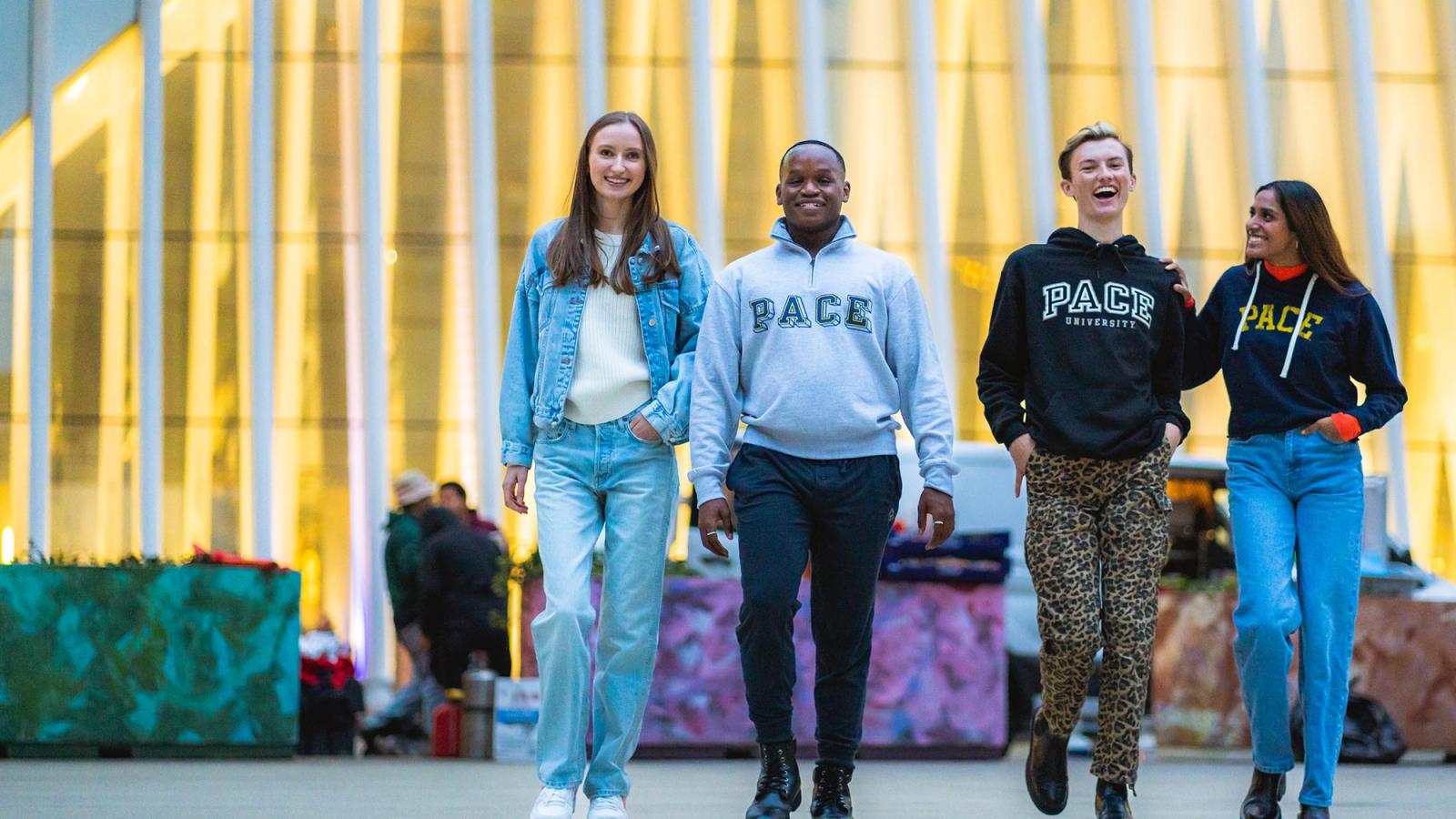 Four Pace students walking in Lower Manhattan